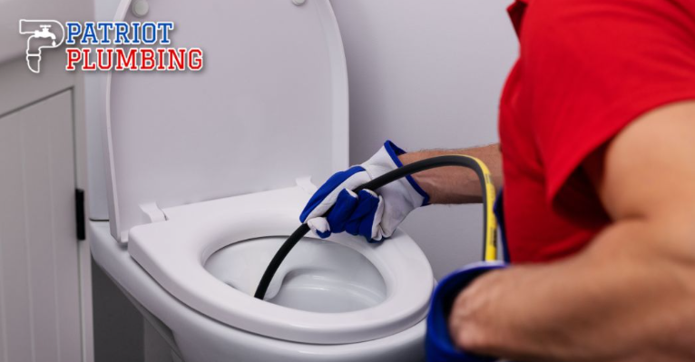 Professional plumber performing toilet repair service